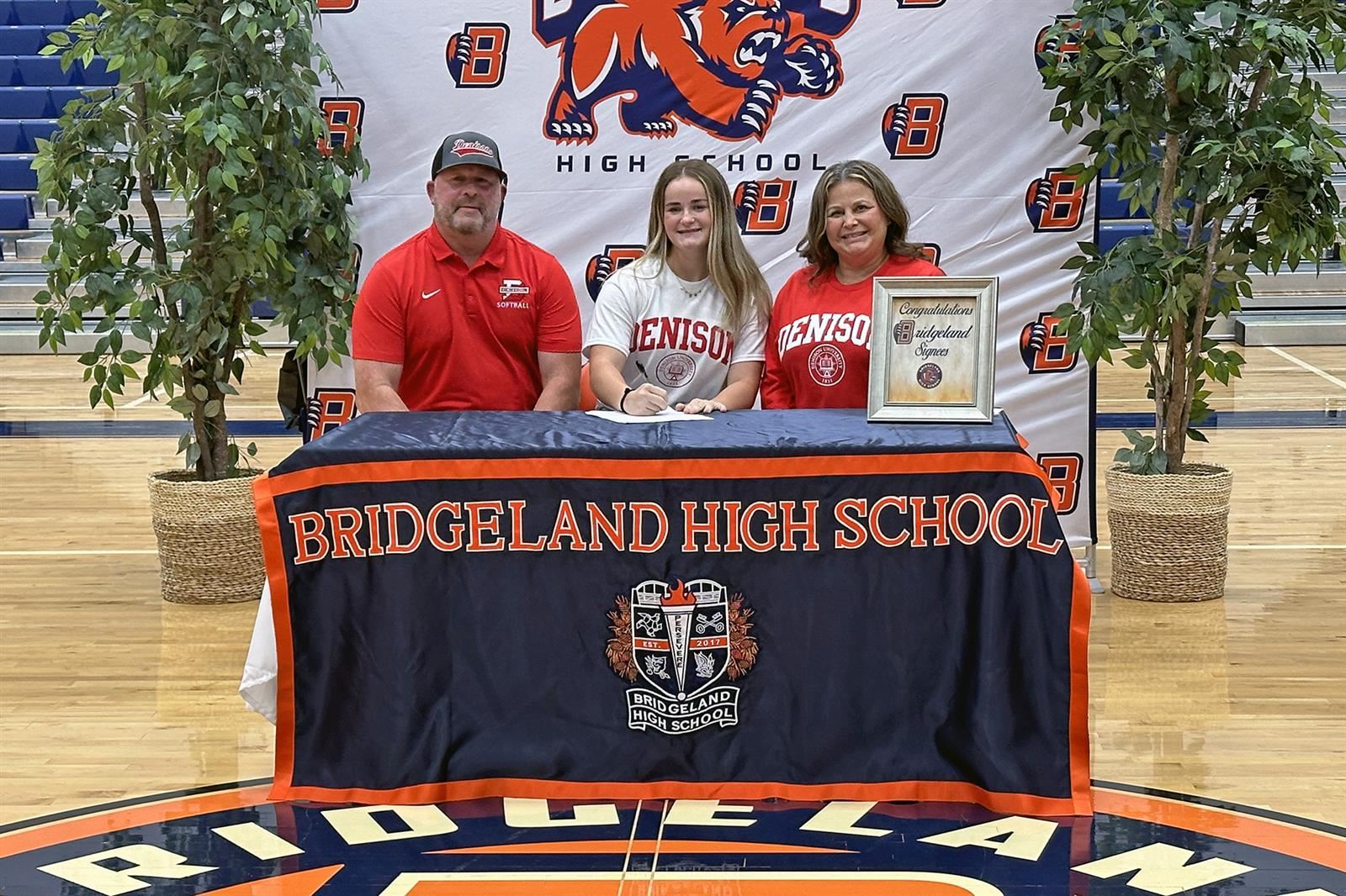 Bridgeland High School senior Carley Melton, center, signed her letter of intent to play softball at Denison University.